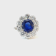 Load and play video in Gallery viewer, Rare 4.2ct GRS ‘Royal Blue’ Unheated Sri Lankan Sapphire &amp; 3ctw Diamond Halo Ring – 18K White Gold
