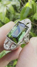 Load and play video in Gallery viewer, ANTIQUE GREEN TOURMALINE AND DIAMOND RING IN PLATINUM
