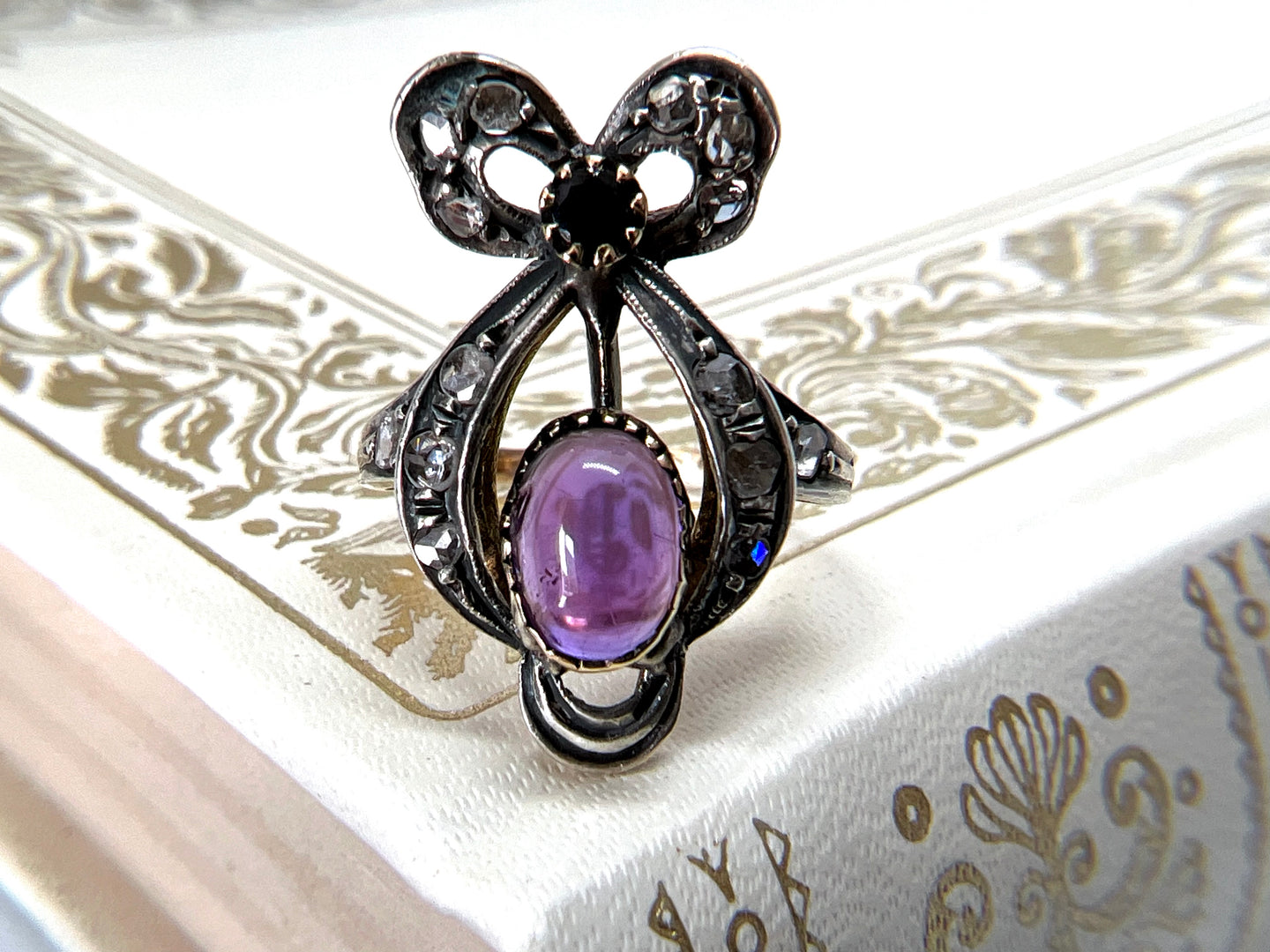 ANTIQUE RIBBON AMETHYST AND DIAMOND RING